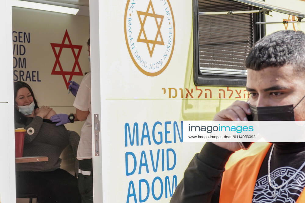 The IDF Home Front Command in coordination with Magen David Adom, serving as the Israeli Red Cross organization and leading EMS, make COVID-19 vaccinating more accessible to those still in denial or refusal operating a mobile vaccination station out of a caravan at Jerusalem s Shuk Mahane Yehuda Market. Jerusalem Israel - ZUMAa126 20210224_zap_a126_019