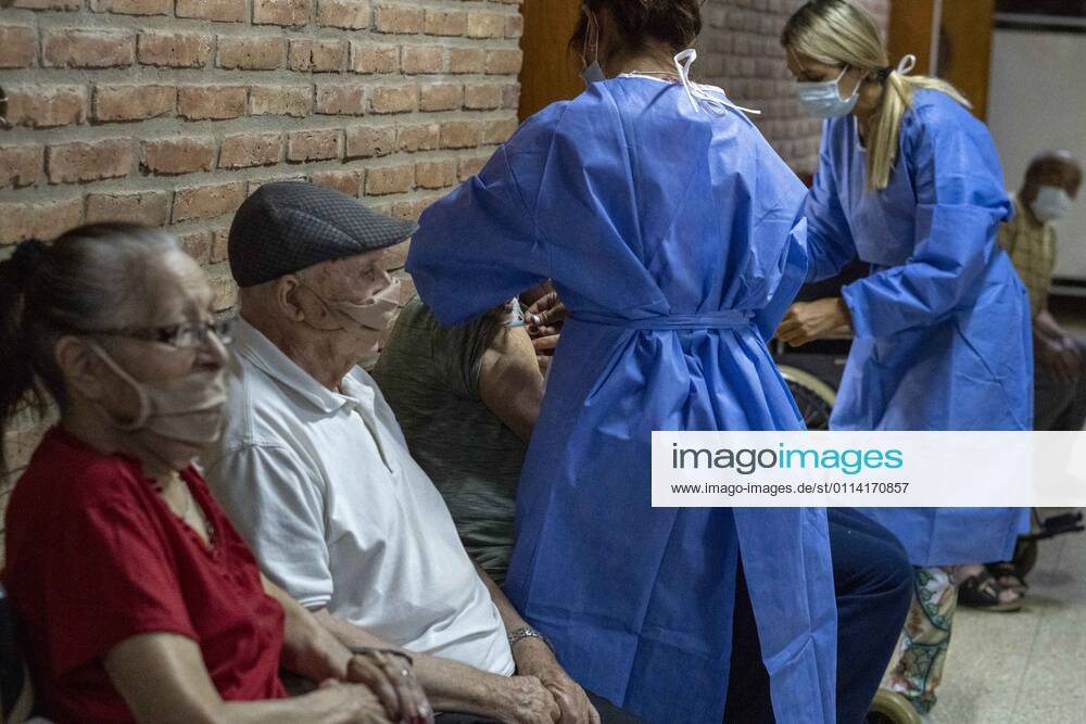 Nurse apply a shot of India s Serum Institute Covishield vaccine against COVID-19 to elderly people inside a makeshift care home functioning in a special school. The original care home inside San Martin Hospital was converted into the COVID-19 sector at the beginning of the pandemic, and the residents were moved into this location. Firmat Argentina - ZUMAm105 20210225_zaf_m105_010
