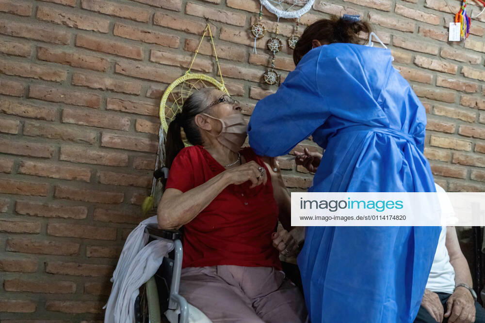 A nurse applies India s Serum Institute Covishield vaccine against COVID-19 to an elderly woman in a makeshift care home at a special school..The original care home inside San Martin Hospital was converted into the COVID-19 sector at the beginning of the pandemic and residents were transferred to a special school. Firmat Argentina - ZUMAs197 20210225_zaa_s197_112