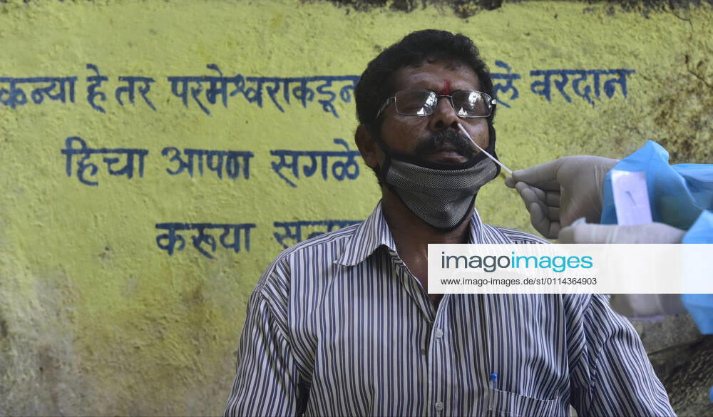 BMC medical staff conducts swab test of resident staying in Sewri, on February 28, 2021 in Mumbai, India. (Photo by Anshuman Poyrekar Hindustan Times) Medical Team Conducts COVID-19 Coronavirus Test