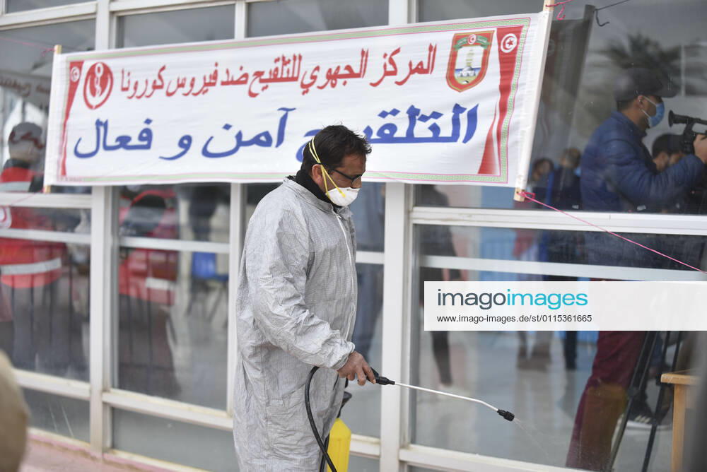 A healthcare personnel receives the first dose of the Sputnik V coronavirus (COVID-19) vaccine at a sahra hospital established in El Menzah Sports Palace as vaccination process begins in Tunis, Tunisia on March 13, 2021. NEWS : Debut du processus de vaccination a Tunis - 13 03 2021 WassimJdidi Panoramic