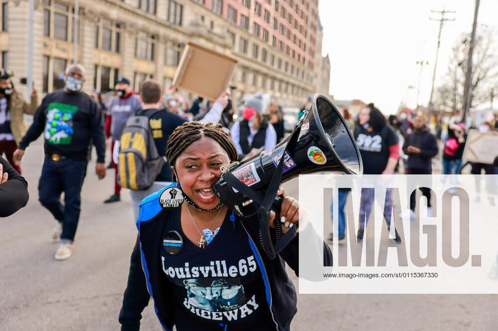 A protester speaks on a megaphone during a memorial march from Jefferson Square Park to mark the one year anniversary since the Louisville Metro Police Department shot and killed Breonna Taylor at her home in Louisville. The protesters call the park, Injustice Square Park. Louisville United States - ZUMAs197 20210313_zaa_s197_233