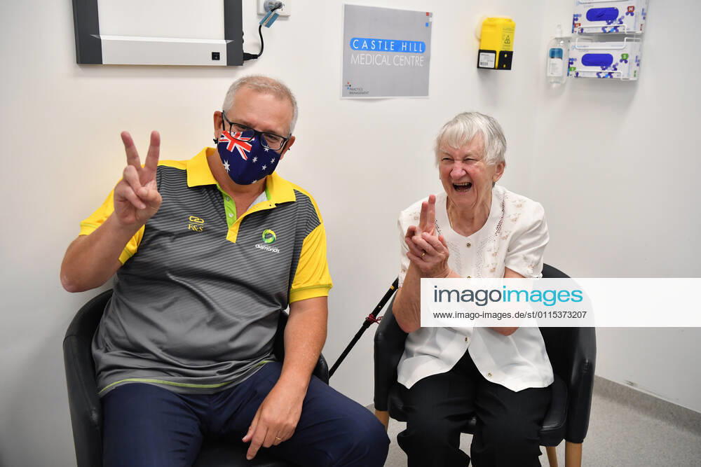 SCOTT MORRISON COVID19 VACCINATION, Australian Prime Minister Scott Morrison gestures alongside Aged care resident Jane Malysiak (left) as she receives her second COVID-19 vaccination during a visit to Castle Hill Medical Centre in Sydney, Sunday, March 14, 2021. ( NO ARCHIVING, , NO USE IN BOOKS WITHOUT CONSENT SYDNEY NSW AUSTRALIA
