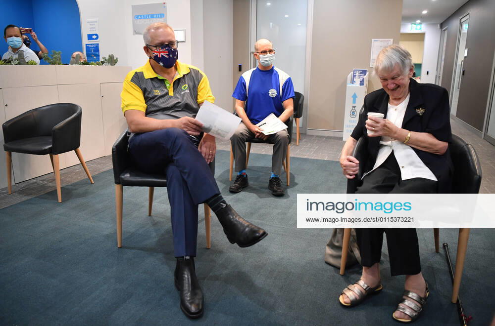 SCOTT MORRISON COVID19 VACCINATION, Australian Prime Minister Scott Morrison joins Aged care resident Jane Malysiak (left) after she received her second COVID-19 vaccination during a visit to Castle Hill Medical Centre in Sydney, Sunday, March 14, 2021. ( NO ARCHIVING, , NO USE IN BOOKS WITHOUT CONSENT SYDNEY NSW AUSTRALIA