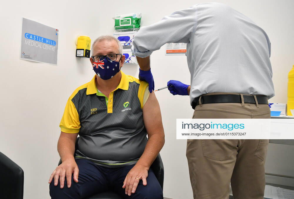 SCOTT MORRISON COVID19 VACCINATION, Australian Prime Minister Scott Morrison receives his second COVID-19 vaccination during a visit to Castle Hill Medical Centre in Sydney, Sunday, March 14, 2021. ( NO ARCHIVING, , NO USE IN BOOKS WITHOUT CONSENT SYDNEY NSW AUSTRALIA