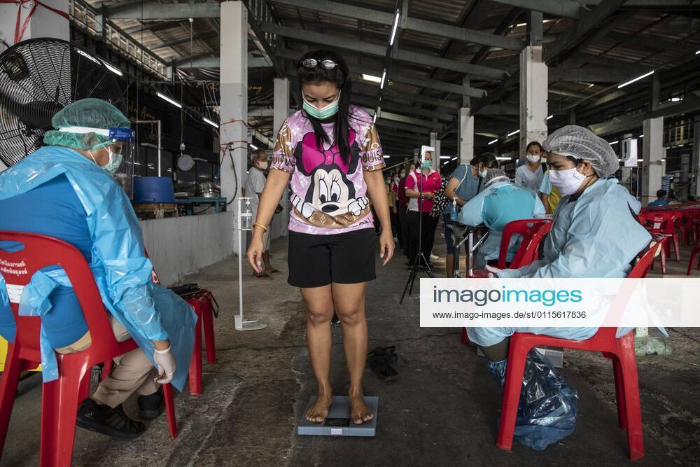 A woman is weighed before lining up to receive a dose of CoronaVac, a Covid-19 coronavirus vaccine developed by Chinas Sinovac Biotech ltd, in Bangkok, Thailand, on Friday March 19, 2021. Health workers have been vaccinating 600 residents per day, after a cluster of Covid-19 coronavirus cases were discovered at the Bang Khae market in Bangkok on Wednesday, March 17. Thailand - ZUMAm249 20210319_zip_m249_018
