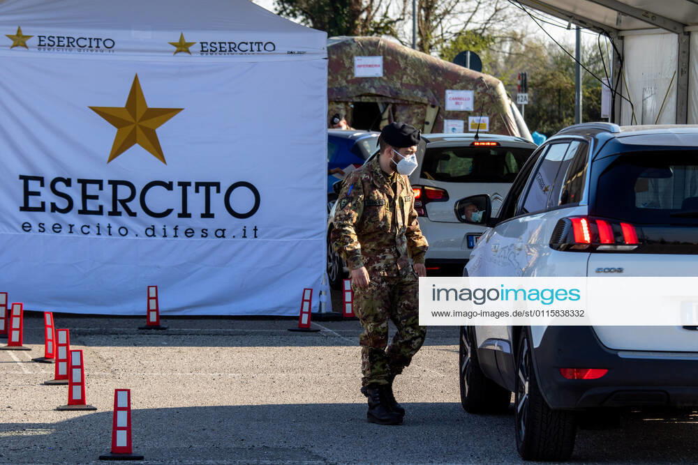 Milan, people queuing in cars for anti Covid vaccines at the drive-thru point in via Novara managed by the army Editorial Usage Only