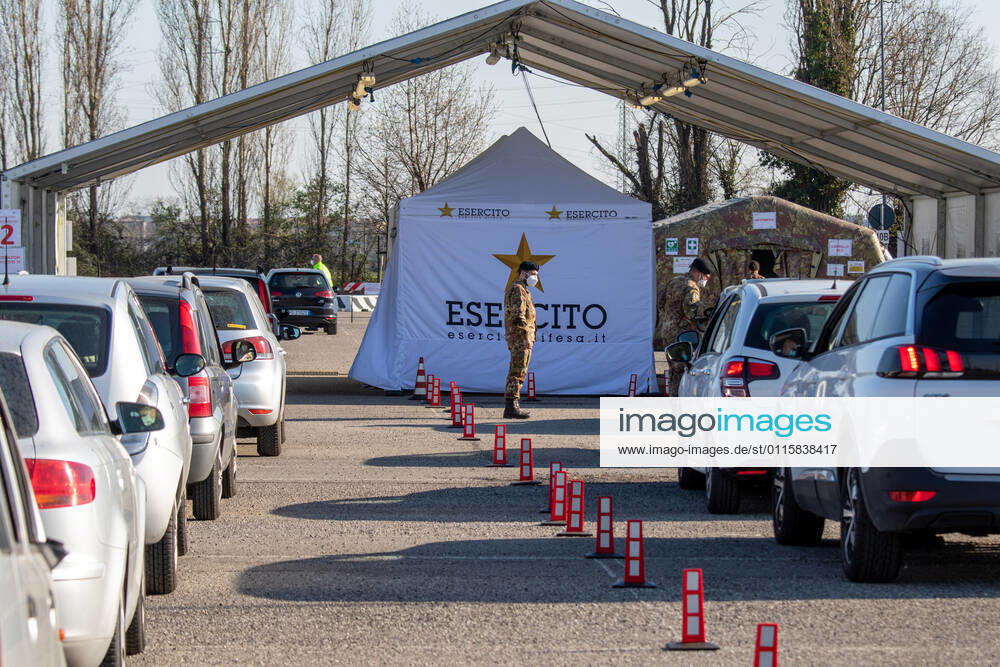 Milan, people queuing in cars for anti Covid vaccines at the drive-thru point in via Novara managed by the army Editorial Usage Only