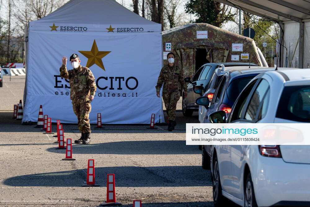 Milan, people queuing in cars for anti Covid vaccines at the drive-thru point in via Novara managed by the army Editorial Usage Only