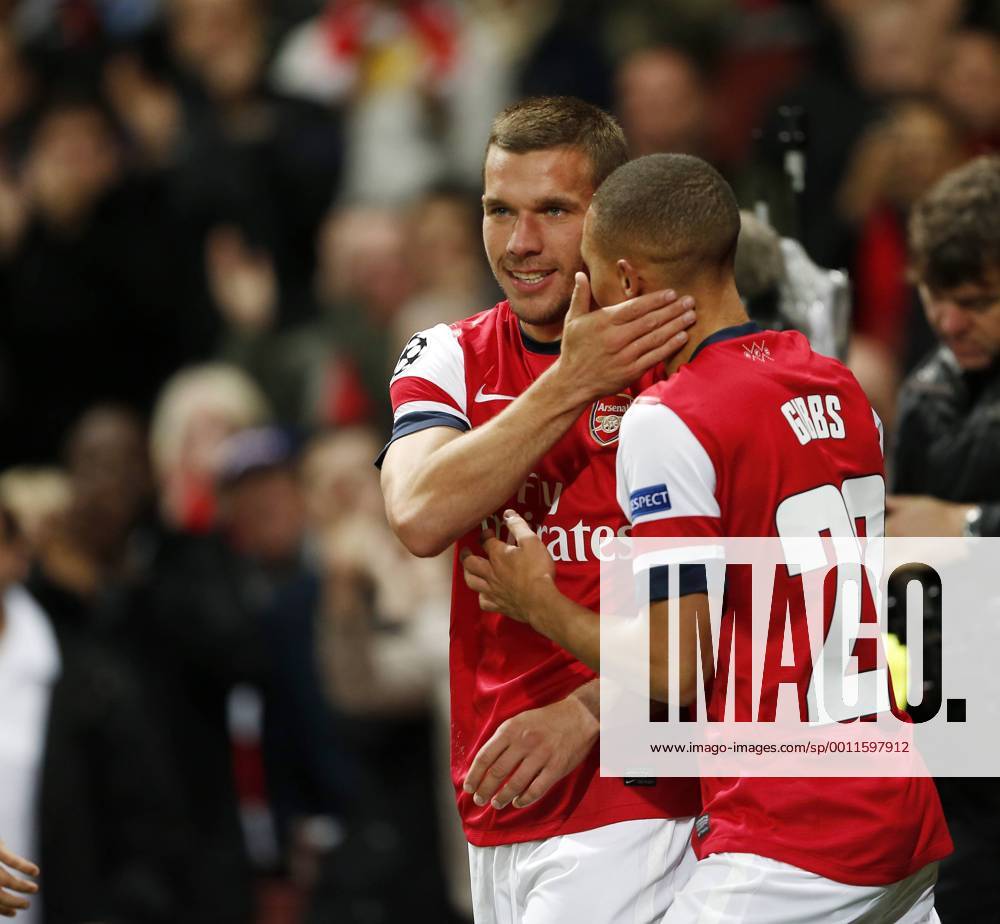 Arsenal s Lukas Podolski celebrates scoring his sides second goal..Football - Champions League Matchday 2 - Emirates Stadium, London - 3 10 12. .