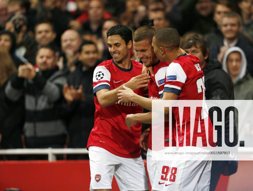 Arsenal s Lukas Podolski celebrates scoring his sides second goal..Football - Champions League Matchday 2 - Emirates Stadium, London - 3 10 12. .