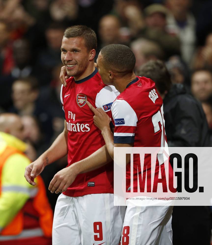 Arsenal s Lukas Podolski celebrates scoring his sides second goal..Football - Champions League Matchday 2 - Emirates Stadium, London - 3 10 12. .