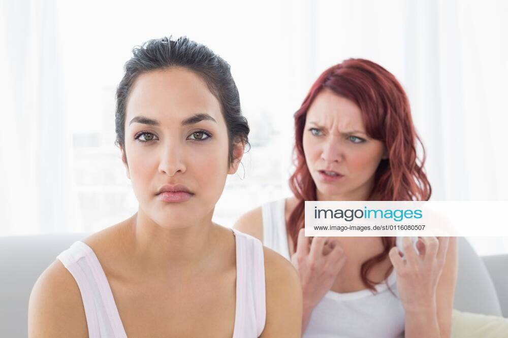 Angry friends having an argument in the living room Angry young female friends having an argument in the living room at home, model released, , property released, Cape Town, South Africa, 15.08.2013, 243754.jpg, home, house, apartment, couch, sofa, living room, sitting room, brown hair, sitting, relationship, together, argument, dispute, disagreement, angry, unhappiness, unhappy, upset, rift, problem, troubles, fight, arguing, fighting, annoyed, beautiful, casual, conflict, crisis, serious, leisure, lifestyle, relaxation, brunette, pretty, attractive, friends, friendship, girls night in, slumber party, gesturing, listening, explaining, stressed, redhead, red hair, tank top 20s, Young Adult, Woman, Female, Mixed-Race, Caucasian, 20-24 Years