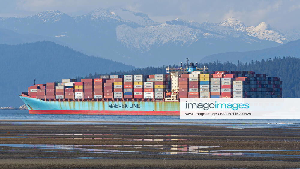 The container ship Anna Maersk at anchor in Burrard Inlet, the outer harbor for the Port of Vancouver, Canada. The parent company of the Maersk Line is A.P. Moller-Maersk. Vancouver Canada - ZUMAs202 20210401_zap_s202_003