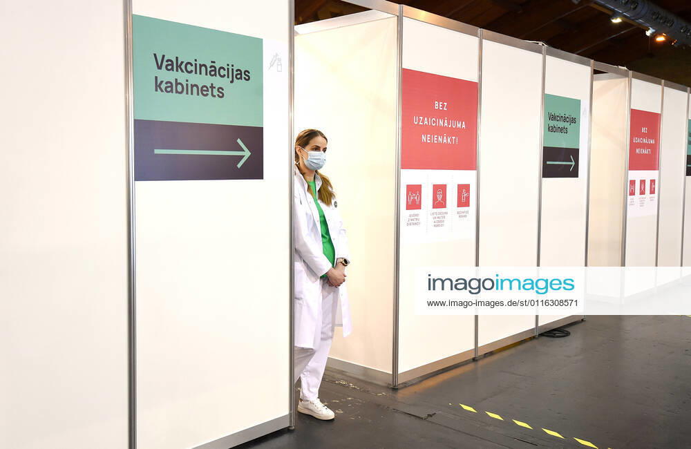 (210403) -- RIGA, April 3, 2021 -- A healthcare worker waits for visitors at a mass immunization center in Riga, Latvia, on April 3, 2021. Latvia on Saturday opened mass immunization centers in eight cities and towns in a bid to ramp up vaccinations against COVID-19, health authorities informed. (Photo by Xinhua) LATVIA-RIGA-COVID-19-MASS IMMUNIZATION CENTER-OPENING EdijsxPalens