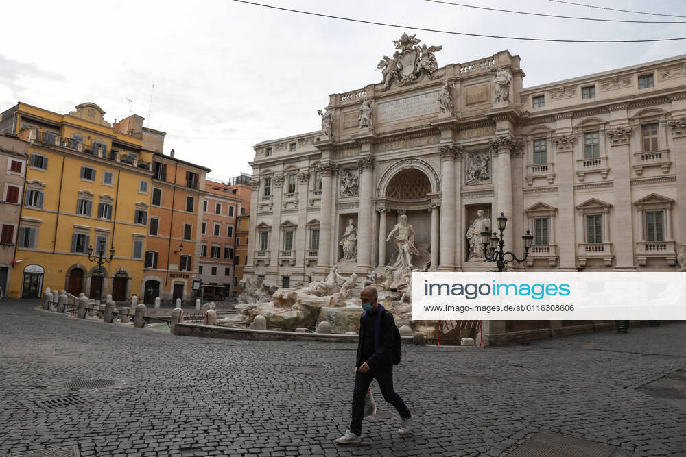 (210404) -- ROME, April 4, 2021 -- A man wearing a face mask walks past Fontana di Trevi in Rome, Italy, April 3, 2021. Italy is spending Easter in lockdown after the government made the whole nation a COVID-19 red zone from Saturday to Easter Monday. ) ITALY-ROME-EASTER-LOCKDOWN ChengxTingting