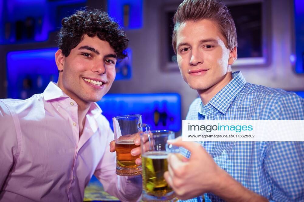Portrait of smiling friends enjoying alcohol Portrait of smiling men enjoying alcohol at nightlcub, model released, , property released, Prague, Czech Republic, 07.04.2016, 773950.jpg, looking, lifestyle, leisure, casual clothing, party, celebration, fun, clubbing, event, stylish, bar, pub, nightclub, nightlife, drunk, disco, youth culture, club, youthful, beer, beer glass, glass, alcohol, cool, entertainment, bar counter, drink, holding, refreshment, freshness, food and drink, enjoying, entertainment club, bonding, friends, socializing, together, friendship, weekend, drinking, smiling, happiness, happy hour, meeting up Indoors,Front view,Portrait,Looking at camera,Head and shoulders