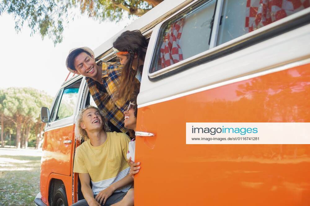 Smiling friends in camper van Smiling friends in camper van at campsite, model released, , property released, Cape Town, South Africa, 09.03.2017, 977754.jpg, smiling, friend, friendship, camper van, van, campsite, lifestyle, leisue, casual, weekend activities, vacation, together, bonding, enjoyment, fun, joy, land vehicle, mode of transport, stationary, looking, orange color, field, toothy smile, happy, camping, travel, millennial Outdoors,Focus on Foreground,Day