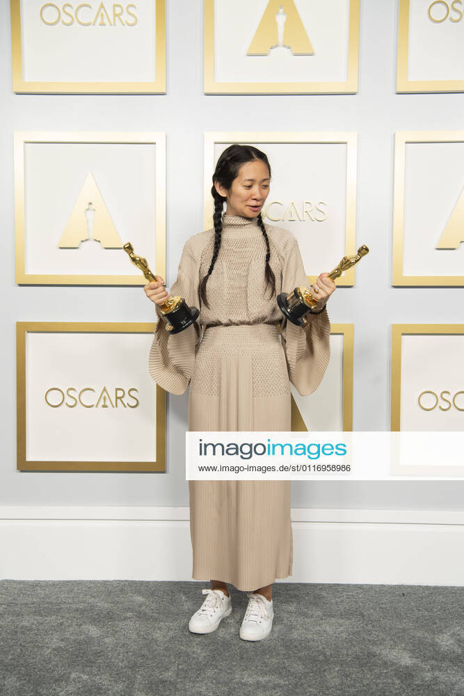 Chloà Zhao poses backstage with the Oscars for Directing and Best Picture during the live ABC Telecast of The 93rd Oscars at Union Station in Los Angeles. Los Angeles USA - ZUMAz03_ 20210425_sso_z03_201