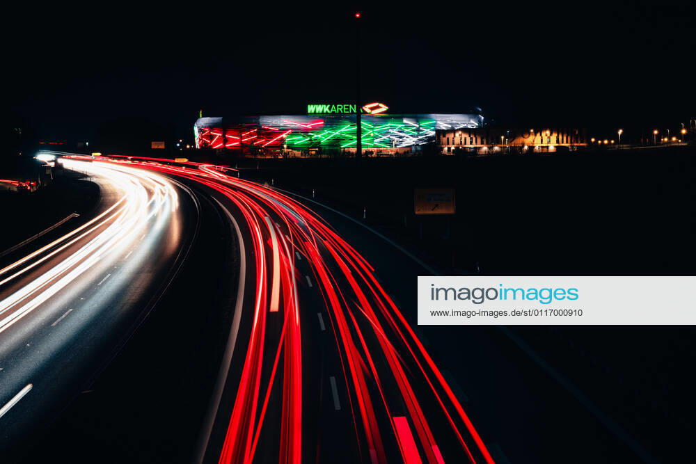Augsburg, Bavaria, Germany - 25 march 2021: WWK soccer stadium of the Fca at night. traces of light from passing cars at night. the wwk arena is illuminated.