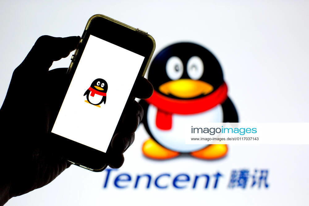 In this photo illustration, the Tencent QQ app seen displayed on a smartphone screen and a Tencent QQ logo in the background. Barcelona Spain - ZUMAd159 20210430_zia_d159_024