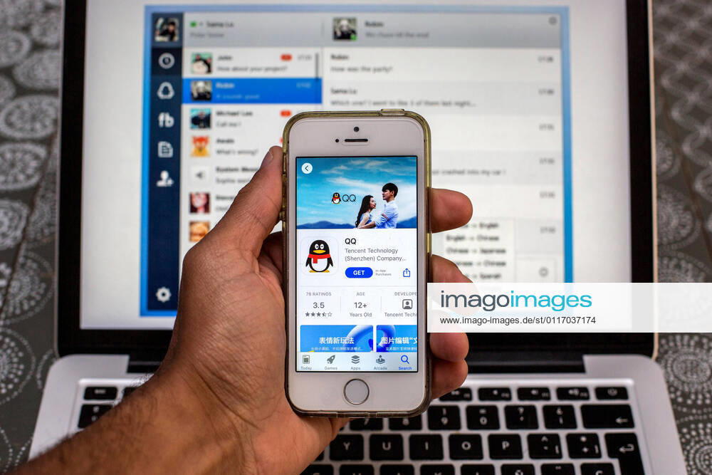 In this photo illustration, the Tencent QQ app in App Store seen displayed on a smartphone screen and a Tencent QQ Desktop on a laptop in the background. Barcelona Spain - ZUMAd159 20210430_zia_d159_004