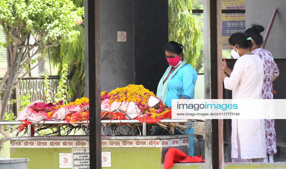 Cremation Of COVID-19 Victims In Rajasthan, India Girls of a family mourn the death of their grandmother before cremation at Hindu Moksha Dham Crematorium, amid coronavirus pandemic in Beawar. Beawar Rajasthan India