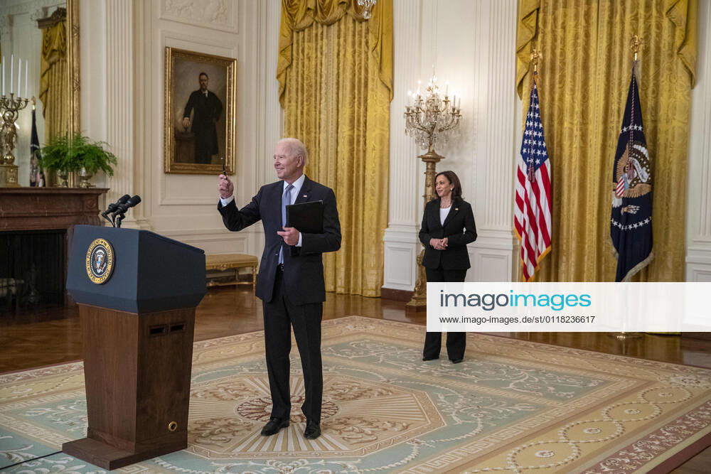 United States President Joe Biden, with US Vice President Kamala Harris, stops to respond to a question from the news media following his remarks on the COVID-19 response and the vaccination program from the East Room of the White House in Washington, DC, USA, 17 May 2021..The President announced the US will share its excess vaccines with other nations Washington USA - ZUMAs152 20210517_zaa_s152_047