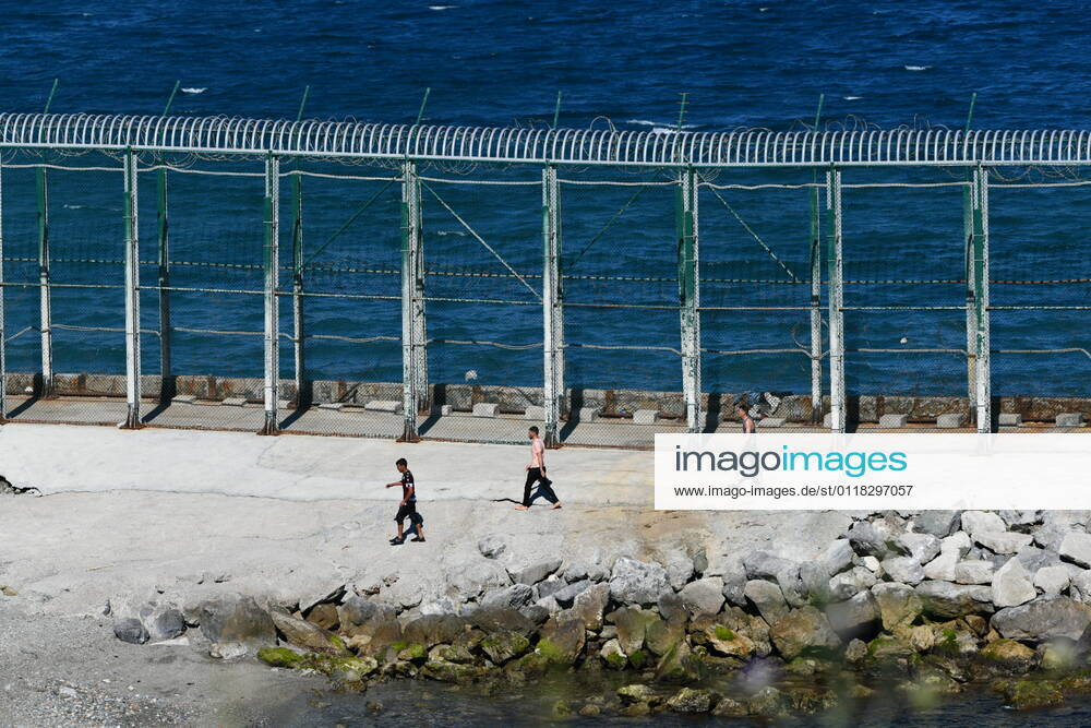 Several young Moroccan migrants in the vicinity of the fence of Ceuta, on the beach of Benzu, on May 17, 2021, in Ceuta, Spain. More than 70 young Moroccan migrants have reached the coast of Ceuta tonight. On their arrival, some of them had to be attended to by the Guardia Civil and the Red Cross. 17 MAY 2021;IMMIGRATION;CEUTA;FENCE;STRAIT;MARROCANS Antonio Sempere LagenciaEP 05 17 2021 Ceuta Ceuta Spain