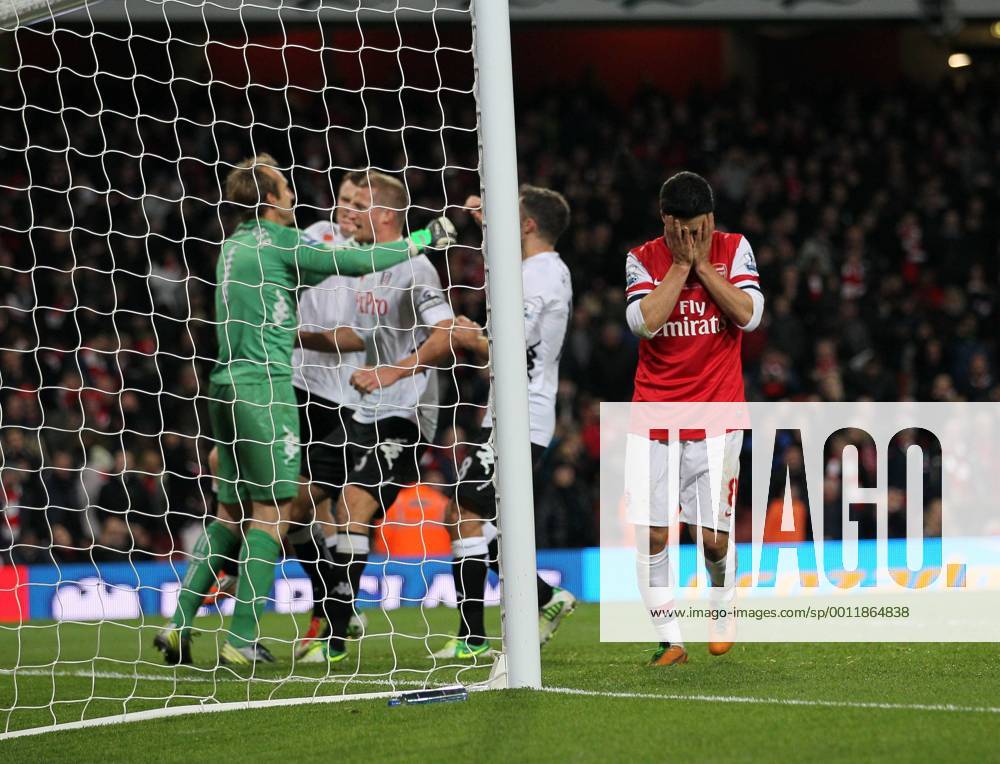Arsenal s Mikel Arteta looks on dejected after missing a last minute penalty as Fulham s players celebrate..Arsenal FC London v Fulham FC s - Premier League - .