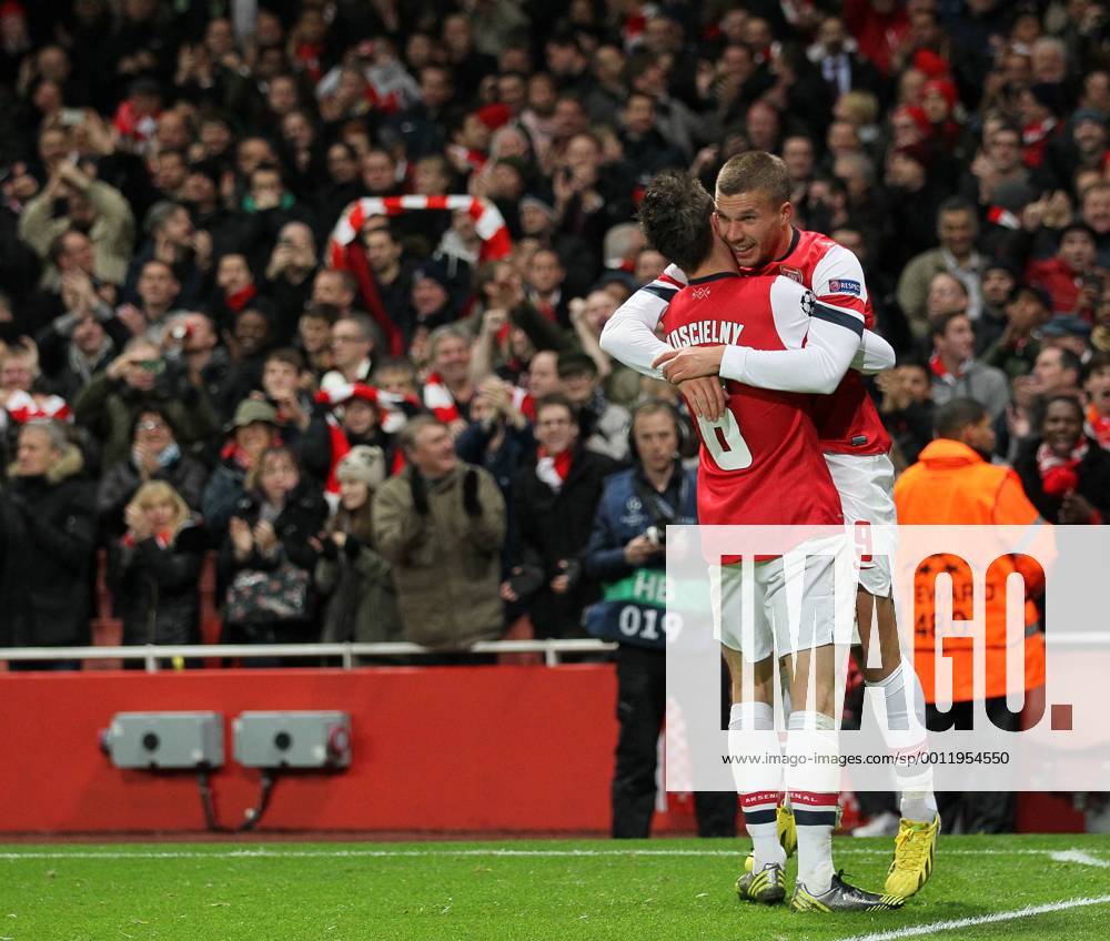 Arsenal s Lukas Podolski celebrates scoring his sides second goal. FC Arsenal London v HSC Montpellier -Champions League- Emirates Stadium,, London- 21 11 12 - Picture DavidxKlein Sportimage .