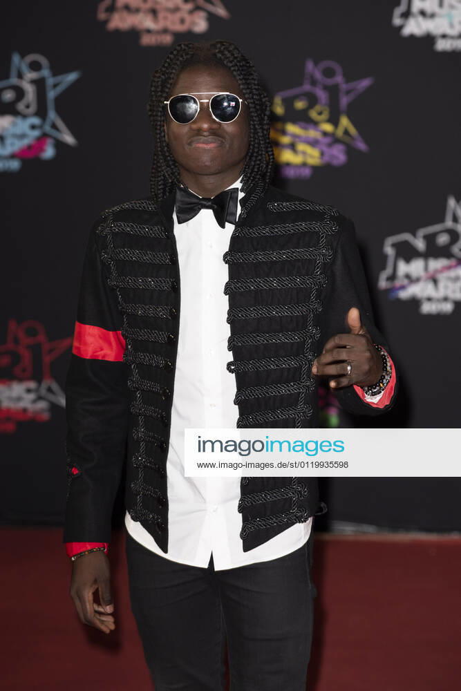 Salif Gueye, alias Salif la Source, on the red carpet before the 2019 NRJ Music Awards ceremony Salif Gueye, alias Salif la Source, on the red carpet before the 2019 NRJ Music Awards ceremony in Cannes (south-eastern France), at the Palais des Festivals convention center on 2019 11 09 Alpes Maritimes 06; Cannes; PACA; Provence Alpes Cote d Azur Europe; Western Europe; France
