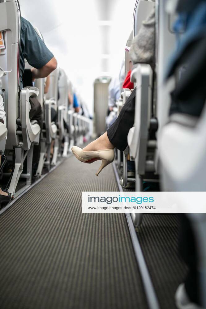 Interior of commercial airplane with passengers in their seats during flight., 05.02.2020 17:01:47,
