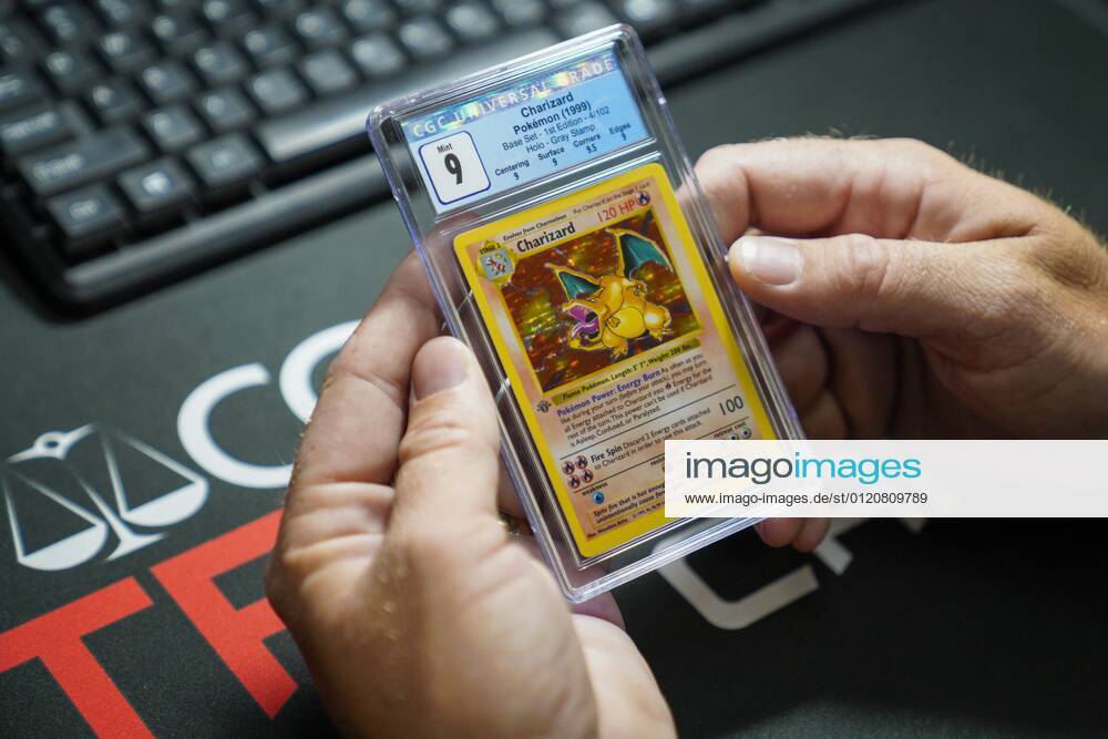 Matt Quinn, holds a first-edition Pokemon Charizard card, graded nine on a scale of 1-10, at at Certified Guaranty Company (CGC), Tuesday, June 8, 2021 in Sarasota. Sarasota USA - ZUMAs70_ 20210608_zan_s70_056