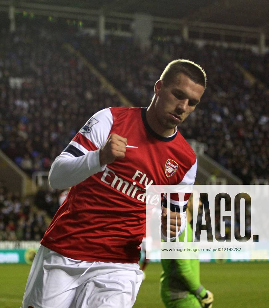 Arsenal s Lukas Podolski celebrates scoring his sides opening goal Reading v Arsenal - Premier League - Madejski Stadium, Reading- 17 12 12 - Picture David Klein Sportimage .