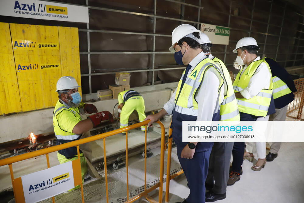 The president of the Junta de Andalucia, Juanma Moreno (c), attends the first welding of the track rail at the Atarazanas metro station. On 26 July 2021, in Malaga (Andalusia, Spain). 26 JULY 2021;PIXELATED Ãlex Zea LagenciaEP 07 26 2021 Malaga (Andalusia) Malaga (Andalusia) Spain