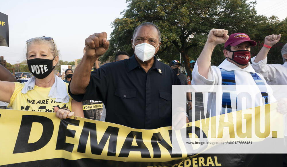 The Rev. JESSE JACKSON (in black) leads faith leaders as voting rights groups march toward the Texas Capitol from north Austin on the third day of a 30-mile journey protesting Republican efforts to suppress votes nationwide and in Texas. Shifts of marchers trade off in an effort to combat oppressive Texas heat. Austin United States - ZUMAd150 20210730_znp_d150_001