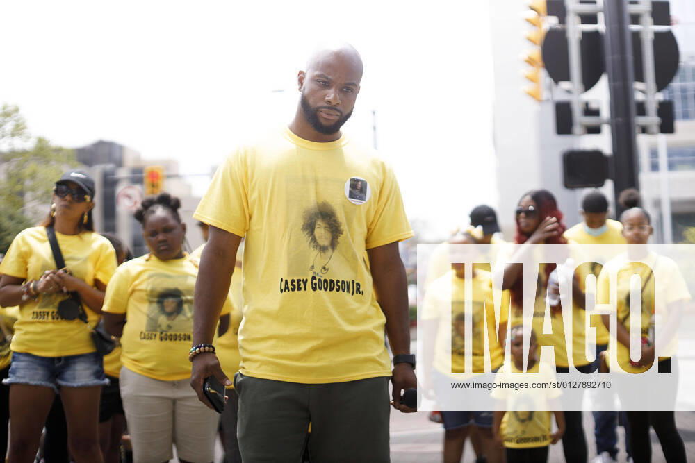 Sean Walton plays and listens to a recording of what Jason Meade had to say about using force against suspects, during the march and rally..Friends and family of Casey Goodson Jr. were joined by Black Lives Matter activists outside of the Franklin County Common Pleas Courthouse for a march and rally to indict former Sheriff Deputy Jason Meade, who shot and killed Casey Goodson Jr. in December of 2020. This rally fell on the birthday of Tamala Payne, the mother of Casey Goodson Jr., and featured prayers from local pastors, a word from family attorney Sean Walton, words from Payne and a brief reflection on Goodson Jr.s character from his younger brother Bredlen Harper Jr. before marching throug - ZUMAs197 20210731_zaa_s197_203