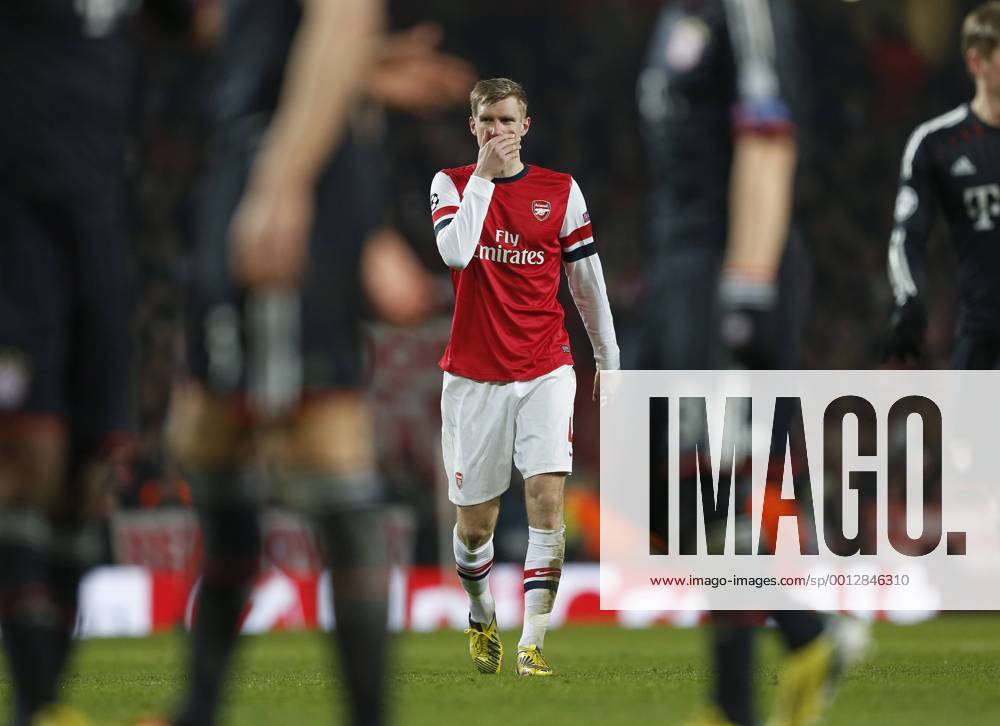 Arsenal s Per Mertesacker looks on dejected..Arsenal v Bayern Munich - Champions League Second Round, First Leg- Emirates Stadium, London- 19 02 13 - Picture David Klein Sportimage .