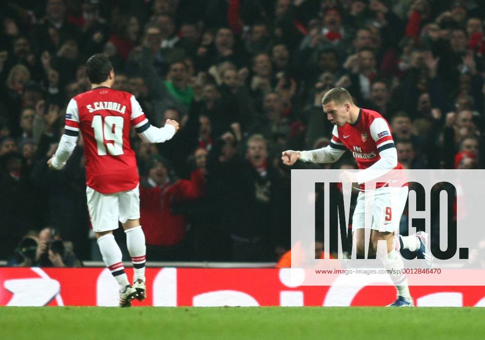 Arsenal s Lukas Podolski celebrates scoring his sides first goal Football - UEFA Champions League - round of 16 - First Leg - Arsenal London v Bayern Munich - 19th February 2013 - Emirates Stadium - London - UK 19022013ArsenalvsBayernMZE08