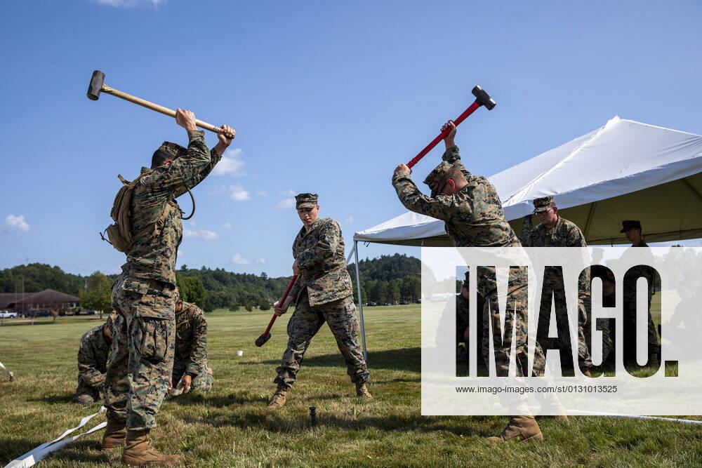 U.S. Marines from Marine Wing Support Squadron 471 hammer a tent spike to raise reception tents for the arrival of Afghans at Volk Field Air National Guard Base, Wisconsin, on August 19, 2021. The Department of Defense, in support of the Department of State, is providing transportation and temporary housing in support of Operation Allies Refuge. This initiative follows through on America s commitment to Afghan citizens who have helped the United States, and provides them essential support at secure locations outside Afghanistan. WAX2021082220 1stxSGT.xMICHELxSAURET