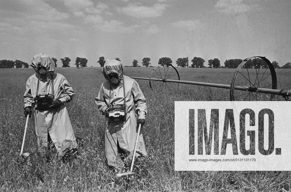 Radiation control out in fields 1098526 27.04.1986 Radiation monitoring technicians dressed in special protective gear perform radiation control in the fields near the Chernobyl nuclear power plant. Igor Kostin Sputnik Kiev region Ukraine