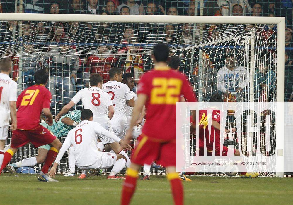 Montenegro s Dejan Damjanovic scoring his sides opening goal..Montenegro v England- World Cup Qualifier - Podgorica City Stadium, Podgorica- 26 03 13 - Picture David Klein Sportimage .