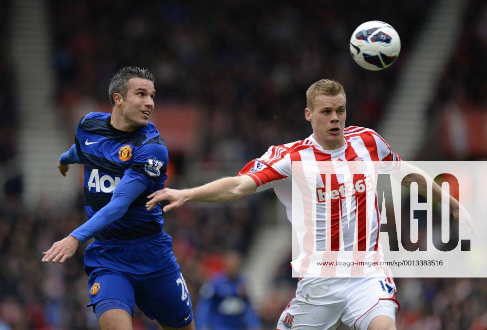 Robin van Persie of Manchester United ManU tussles with Ryan Shawcross of Stoke City - Barclays Premier League - Stoke City vs Manchester Utd - Britannia Stadium - Stoke - England - 14 04 13 - .