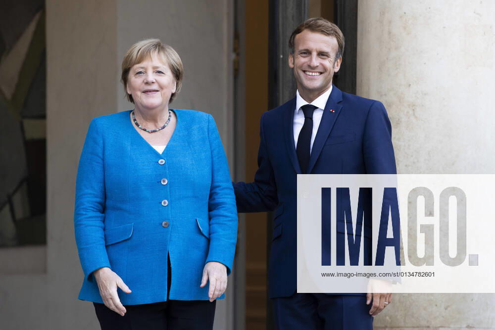 - French President Emmanuel Macron welcomes Chancellor of the Federal Republic of Germany Angela Merkel at the Elysee Palace.