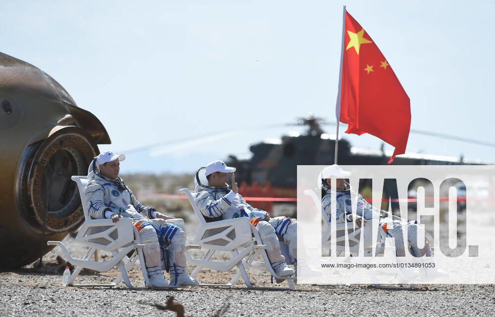 (210917) -- DONGFENG LANDING SITE, Sept. 17, 2021 -- Astronauts Nie Haisheng (C), Liu Boming (R) and Tang Hongbo are out of the return capsule of the Shenzhou-12 spaceship at the Dongfeng landing site in north China s Inner Mongolia Autonomous Region on Sept. 17, 2021. Three Chinese astronauts, the first sent to orbit for space station construction, have completed their three-month mission and returned to Earth safely on Friday. ) (EyesonSci) CHINA-SHENZHOU-12-RETURN (CN) LianxZhen