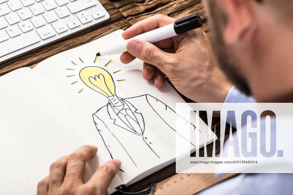 Businessman Drawing A Person With Light Bulb Head model released, Symbolfoto, 12.10.2020,