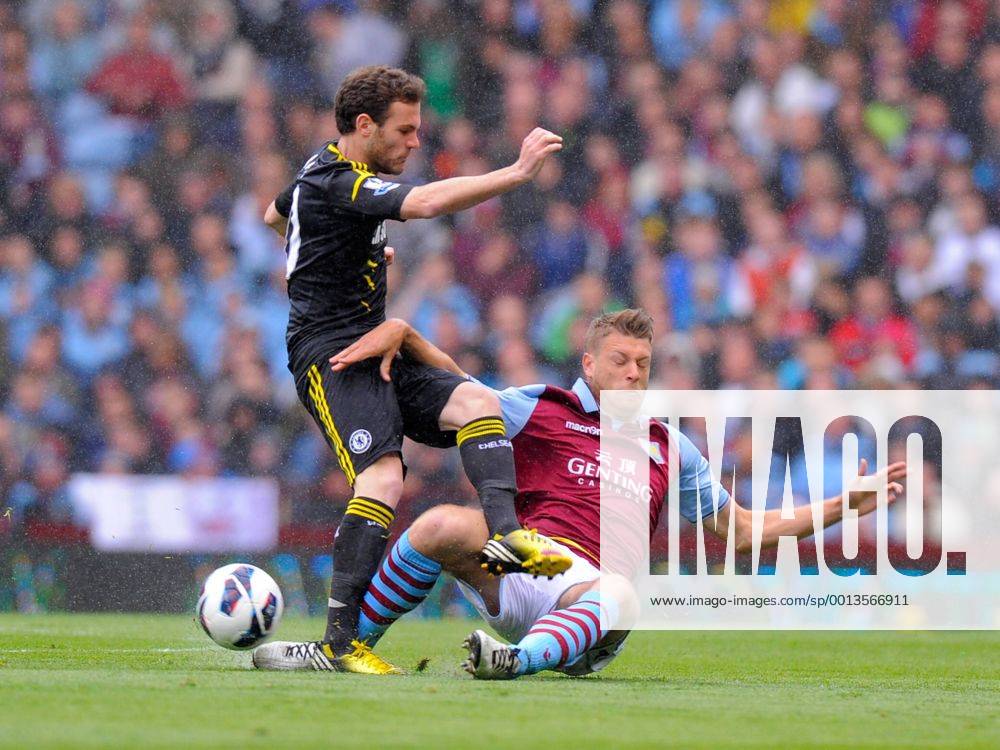 Nathan Baker of Aston Villa tackles Juan Mata of Chelsea, the tackle earned Baker a yellow card - Barclays Premier League - Aston Villa vs Chelsea - Villa Park Stadium - Birmingham - England - 11 05 13 - Picture Simon Bellis Sportimage .