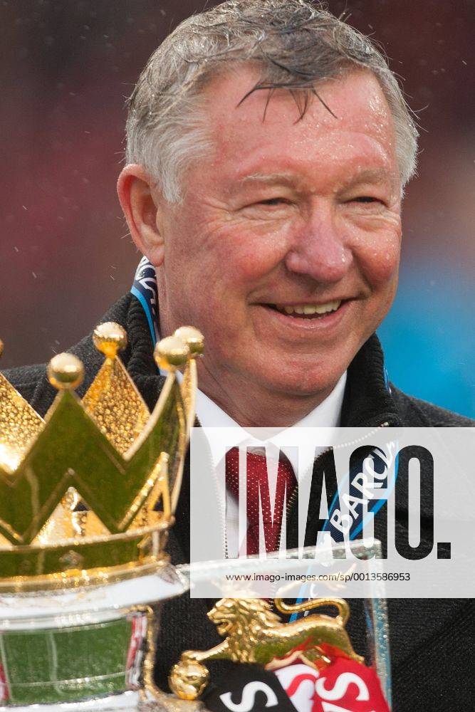 Football - Premier League 2012 2013 - Manchester United ae Alex Ferguson, manager of Manchester United celebrates with the trophy at Old Trafford