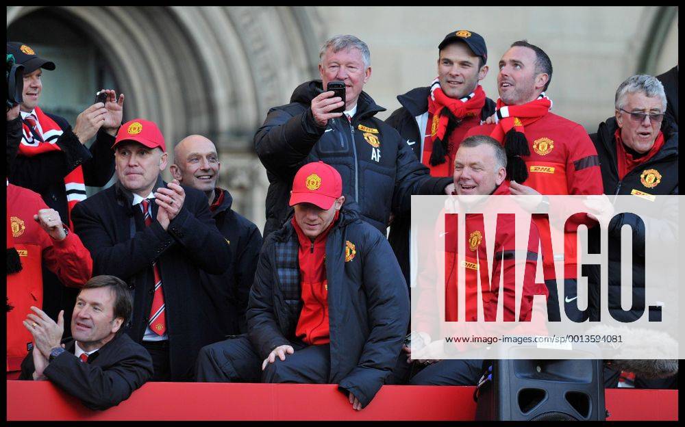 Sir Alex Ferguson takes a picture on his Mobile phone of the fans in Albert Square, Manchester, As Manchester United celebrate winning their 20th league title winning the Premier League, Monday May 13, 2013. AndrewxParsonsx xi-Images AJP